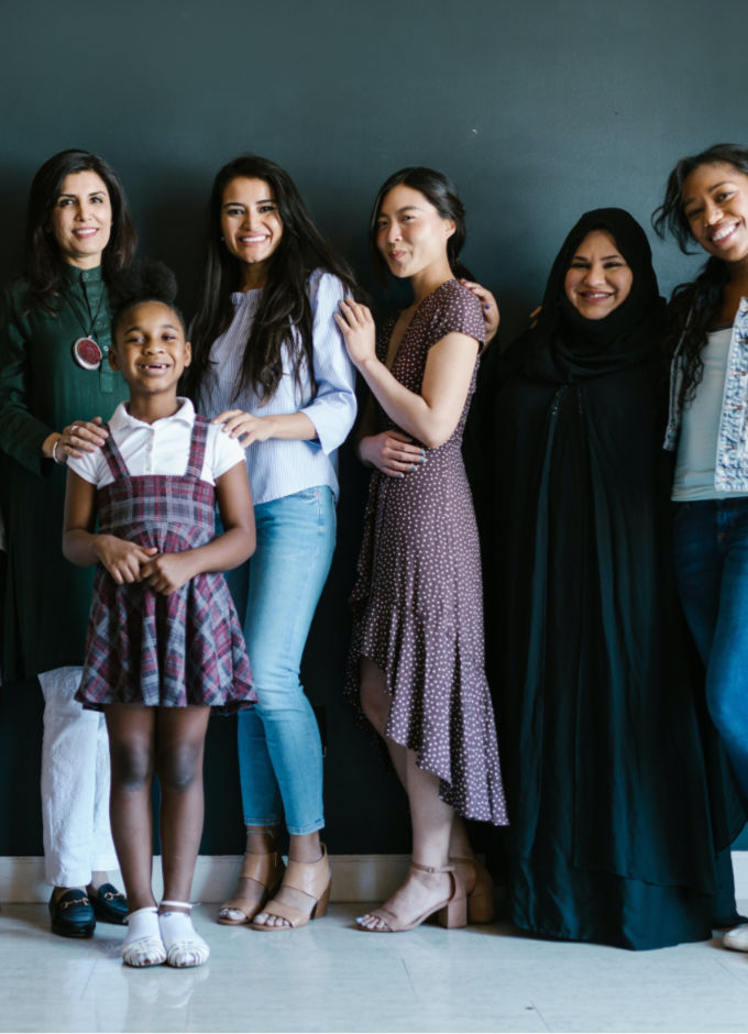A group of multiracial women from young age to older age.