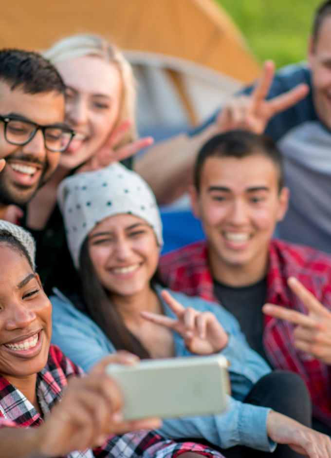 A group of happy youth taking selfie